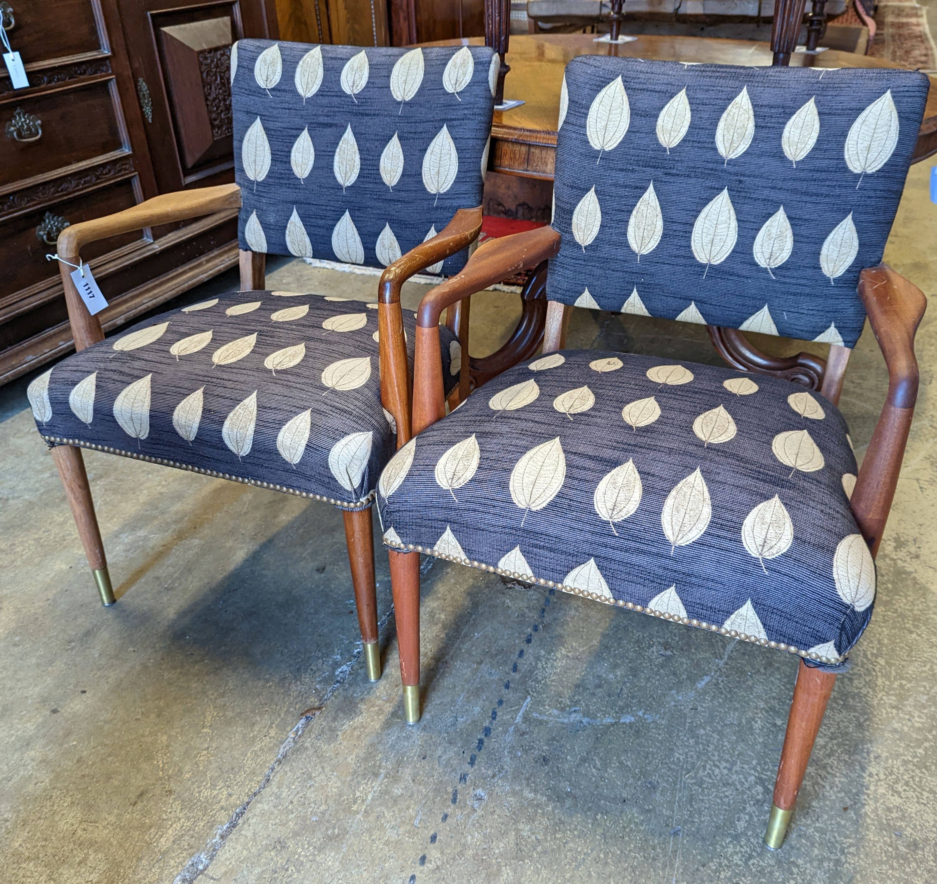 A pair of mid century Danish design teak elbow chairs, width 60cm, depth 54cm, height 83cm